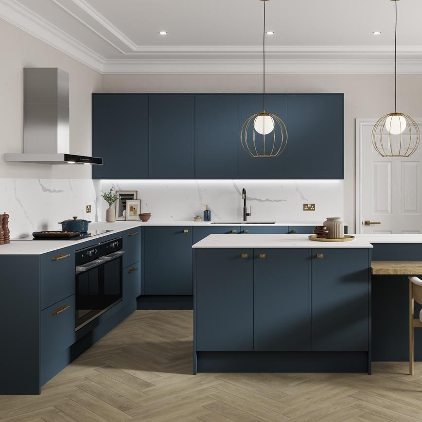 Marine blue kitchen idea with slab doors in an island layout. Has white worktops, light chevron floors, and knob handles.