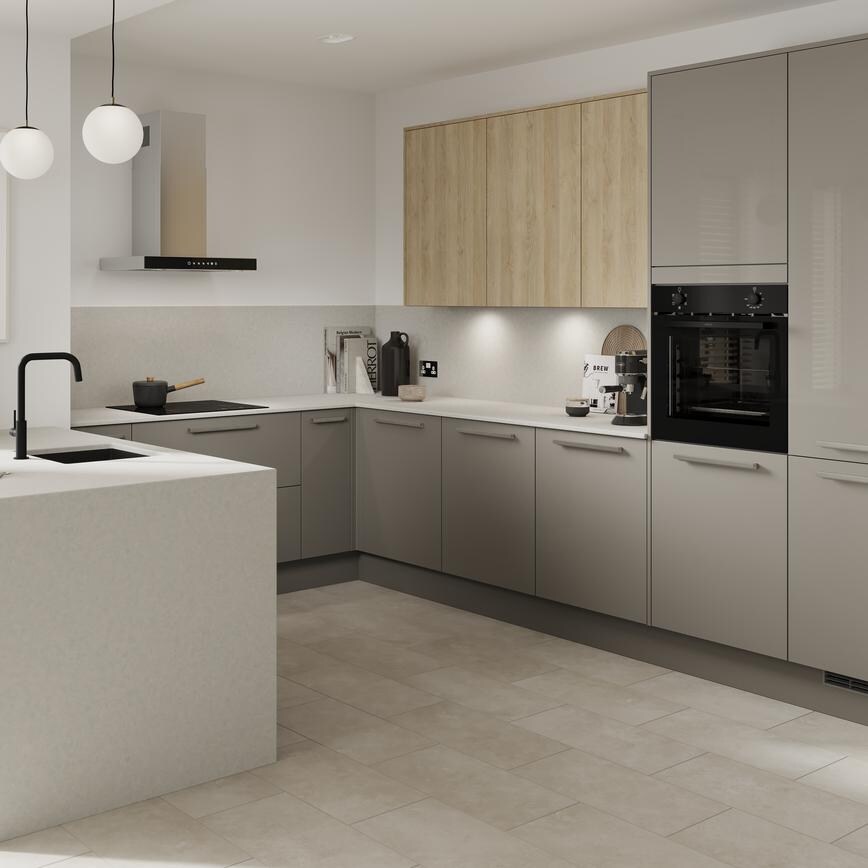 A gloss modern kitchen in a peninsula layout and sand grey colour. It has a white breakfast bar and integrated appliances.