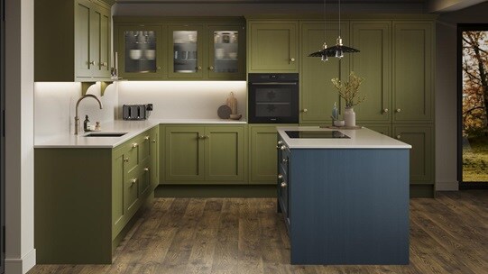 An olive shaker kitchen from Ilfracombe, in an l-shaped layout and a marine blue island. It also has dark oak flooring. 