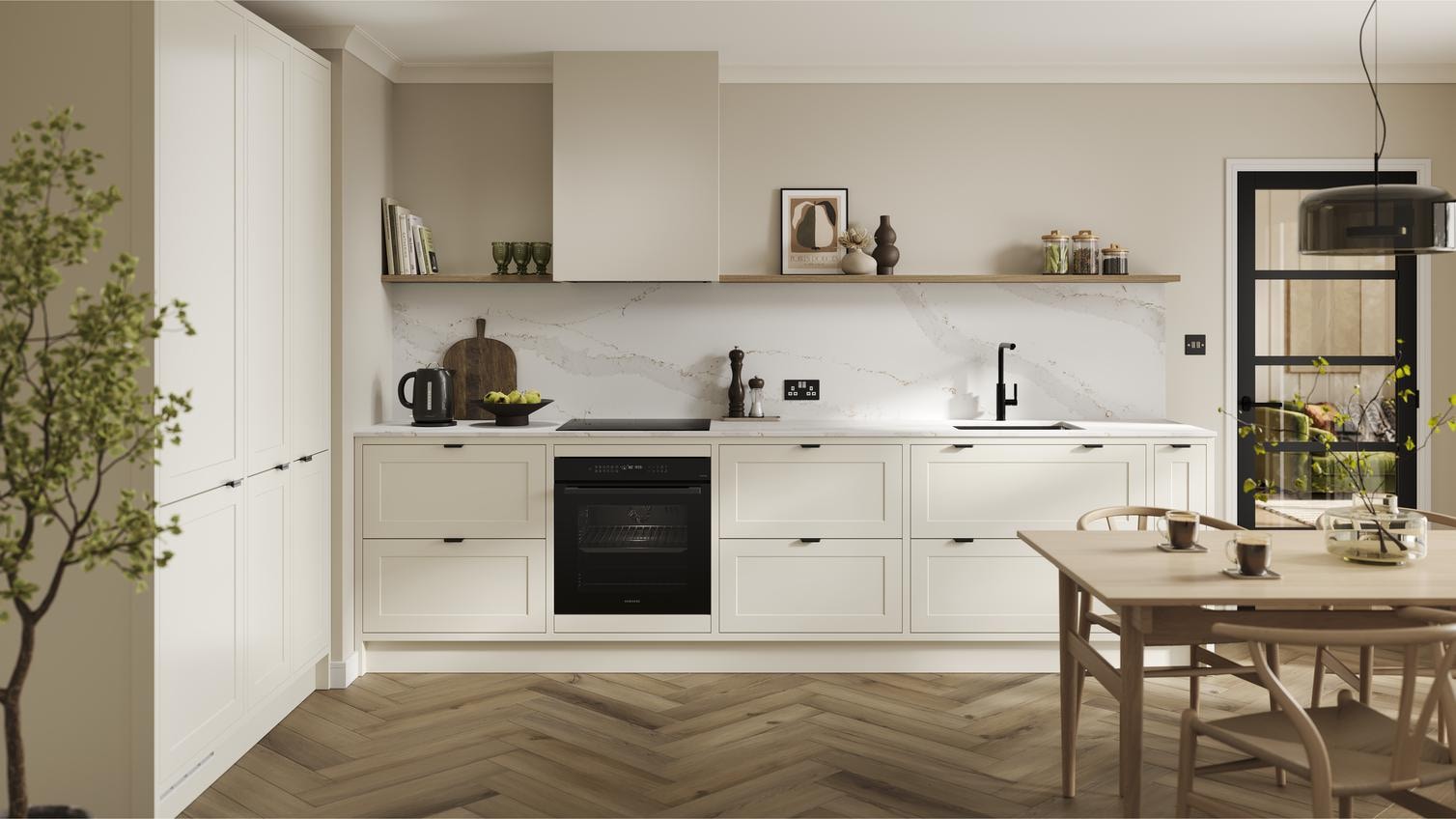 A shaker, porcelain kitchen in an in-frame peninsula layout from the Frome range. It has oak flooring & green wall cabinets.