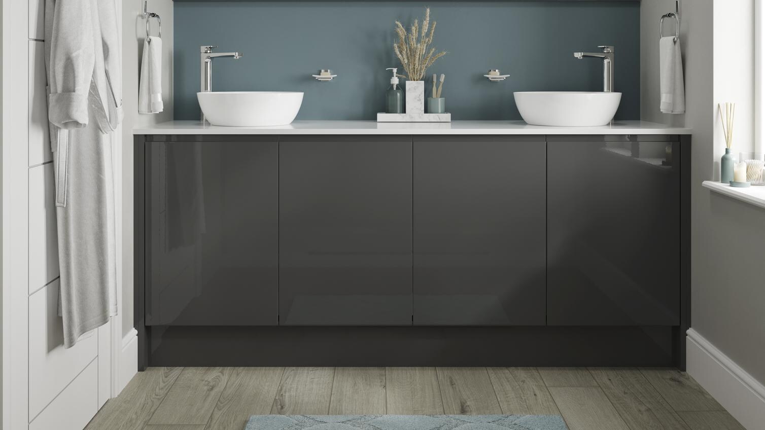 Charcoal bathroom with gloss cupboard doors. Includes a white square-edged worktop, two white basins, and silver lever taps.