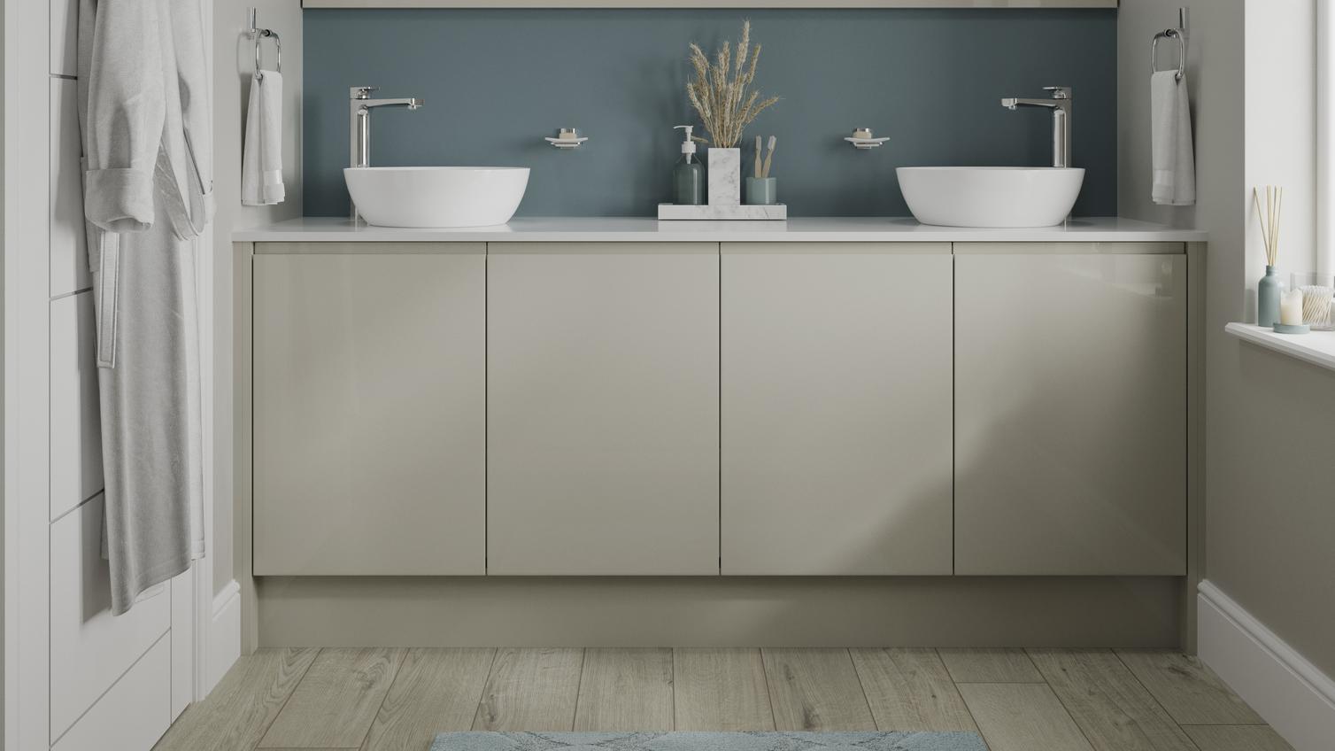 Small gloss bathroom with integrated handle doors in a sandstone shade. With white round ceramic sinks, and chrome lever taps